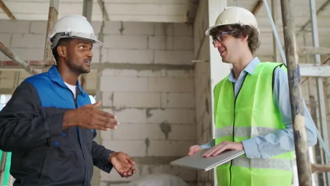 C0056 Engineer and architectural holding laptop and discuss on site Stock Footage 204924889