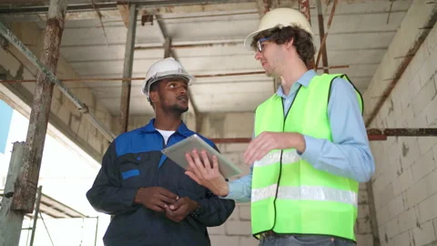 C0060 Engineer and architectural holding tablet and discuss on site Video stock 204924917
