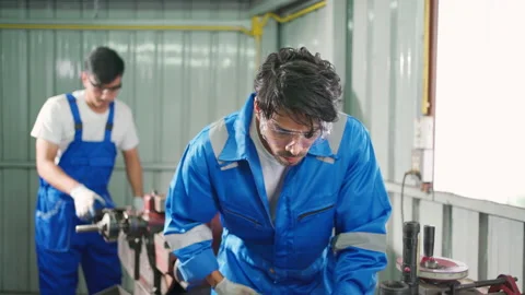 C0095 1 Worker using lathe tool to make flat surface of brake disc Stock Footage 204719463