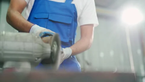 C0100 Worker using lathe tool polishing in the garage Stock Footage 204719386