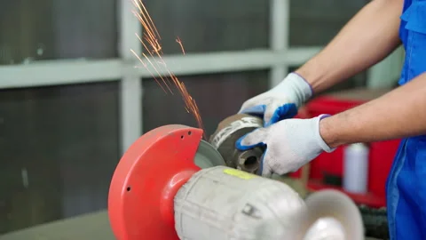 C0101 Worker using lathe tool polishing to make flat surface in the garage Stock Footage 204719508