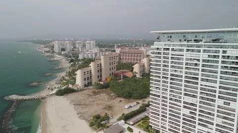 C06 Drone Footage Passing Building Mexican Shoreline White Sand Beach Resort Stock-Footage 322043832