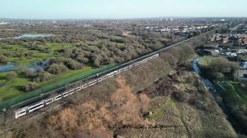 C2C Train From The Air Drone Image over East London Stock Footage 263347635