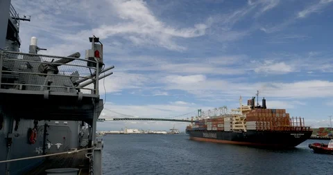 C4K-Container ship passing under guns of battleship Iowa Stock-Footage 106803181