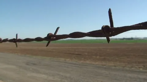 CA Central Valley Barb Wire pan with dirt field Stock Footage 10736964