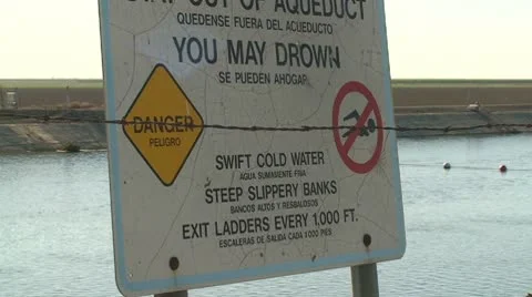 CA Central Valley CA Aquaduct Sign pan to Field Stock Footage 10737248
