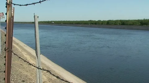 CA Central Valley CA Aquaduct Water Flows Stock Footage 10737310