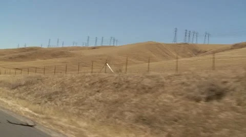 CA Central Valley Endless Dry Hills from moving truck Stock Footage 10737462