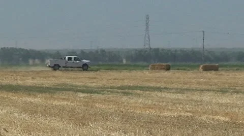CA Central Valley Pickc-up truck Drives past empty field Video stock 10737962