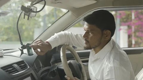 Cab driver using map navigation or gprs on mobile phone for travelling - cocnept Stock Footage 170304946