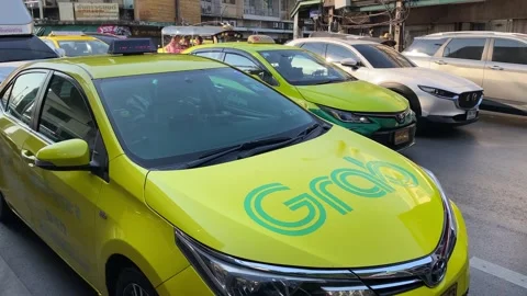Cab driver working for Grab startup company in Bangkok, Thailand 4K Stock Footage 266127315