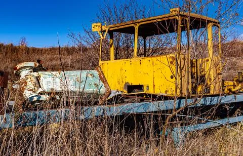 The cab from the tractor standing on the platform in the dump Stock Photos