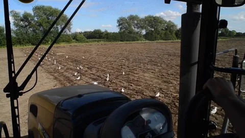 Cab view of farmer cultivating soil ready for seeding ellerton united kingdom Stock Footage 80782286