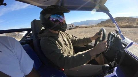 In cab view of UTV rider driving quad at Hungry Valley in Gorman, Stock Footage 98715430