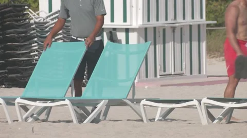 Cabana Boy Fixing Beach Chairs Stock Footage 311548825