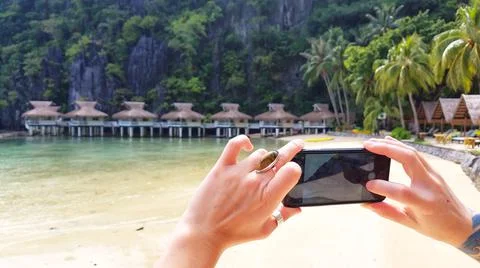 Cabanas in the Philippines, taking a photo on the phone Stock Photos