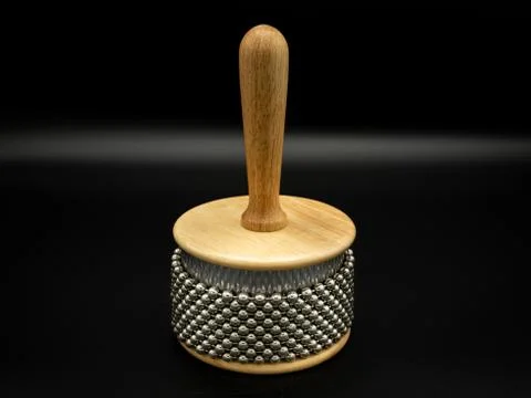 A cabasa in front of black background Stock Photos