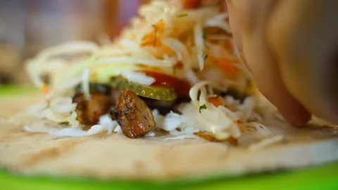 Cabbage is added to the pita bread filling, close-up. Making shawarma at home Video stock 309544526