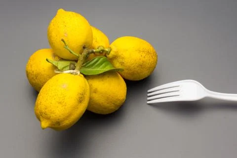 Cabbage and lemons on gray background Stock Photos