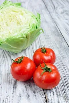Cabbage and tomatoes Stock Photos