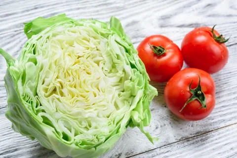 Cabbage and tomatoes Stock Photos