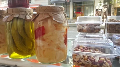 Cabbage beetroot and pickled cucumber in glass jar with graft paper and drawstri Stock Footage 144594752