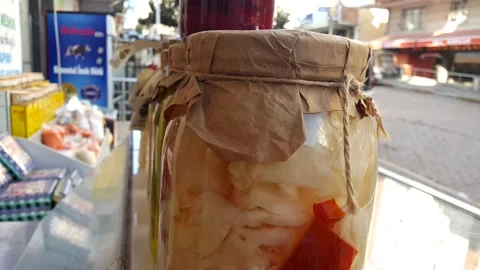 Cabbage beetroot and pickled cucumber in glass jar with graft paper and drawstri Stock Footage 144594811