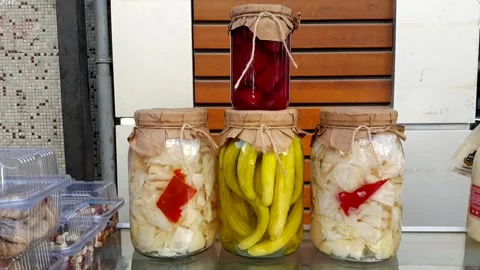 Cabbage beetroot and pickled cucumber in glass jar with graft paper and drawstri Stock Footage 144594931