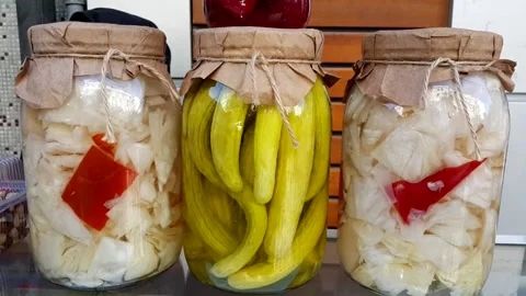 Cabbage beetroot and pickled cucumber in glass jar with graft paper and drawstri Stock Footage 144594970