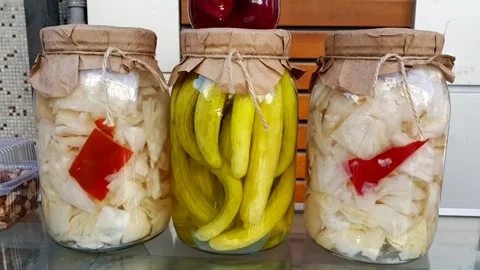 Cabbage beetroot and pickled cucumber in glass jar with graft paper and drawstri Stock Footage 144595121
