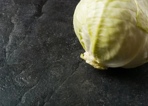 Cabbage on a black stone background Stock Photos