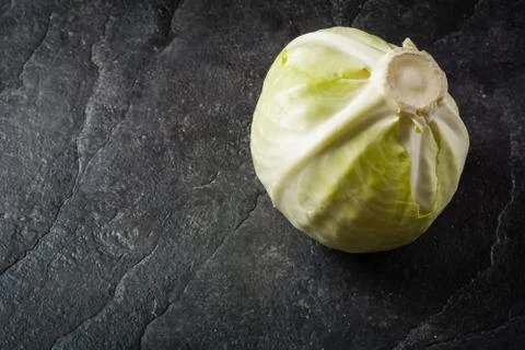 Cabbage on a black stone background Stock Photos