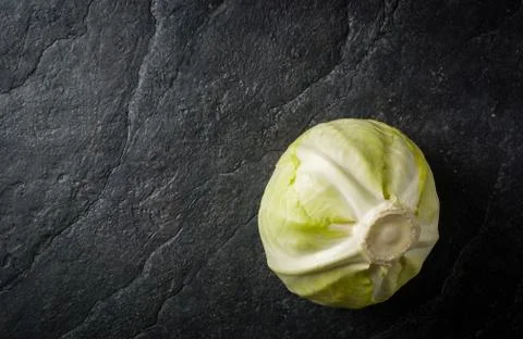Cabbage on a black stone background Stock Photos