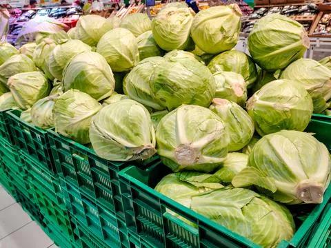 Cabbage is in the boxes in the supermarket Stock Photos