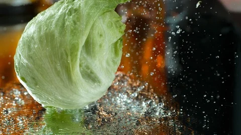 Cabbage ,Brussels , falling into Water against Black Background, Slow Motion 4K Stock Footage 114986048