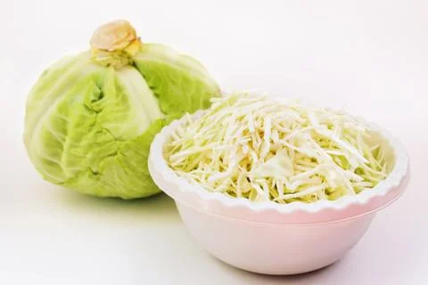 Cabbage with a cup of shredded cabbage Stock Photos