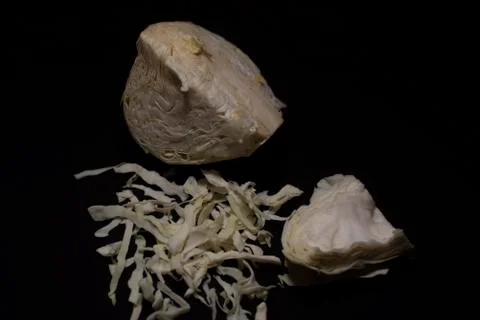 Cabbage cut in shredded form kept in a dark copy space background. Stock Photos