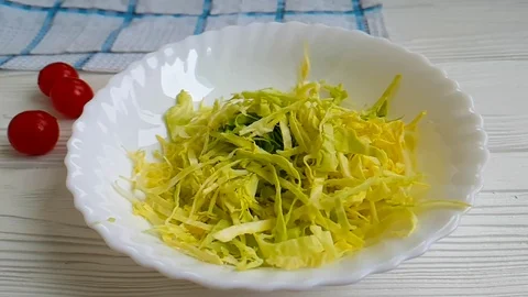 Cabbage drop t in a plate slow-motion shot Stock Footage 89765597