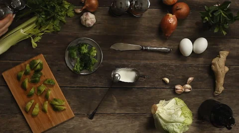 Cabbage, garlic and onions on old wooden table Stock Footage 63173775