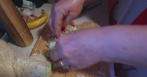 Cabbage preparing on a wooden cutting board Stock Footage 324904233