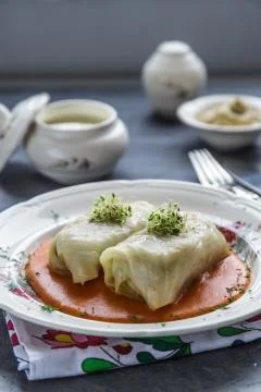 Cabbage roll, golubtsi in ceramic bowl on dark background, traditional Ukrainian Stock Photos