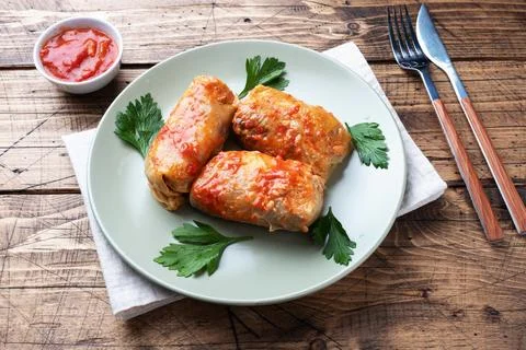 Cabbage rolls with beef, rice and vegetables on the plate. Stuffed cabbage .. Stock Photos
