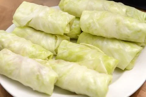 Cabbage rolls with meat and rice, stuffed cabbage on a white plate Stock Photos