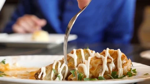 Cabbage rolls on a platter, someone is eating cabbage rolls. 4k, slow motion Stock Footage 82184883