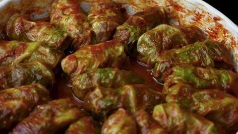 Cabbage Rolls Stuffed with Meat and Rice in Tomato Sauce. Close-up of tradi.. Stock Footage 331215176