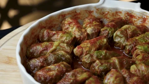 Cabbage Rolls Stuffed with Meat and Rice in Tomato Sauce. Close-up of tradi.. Video stock 331215182