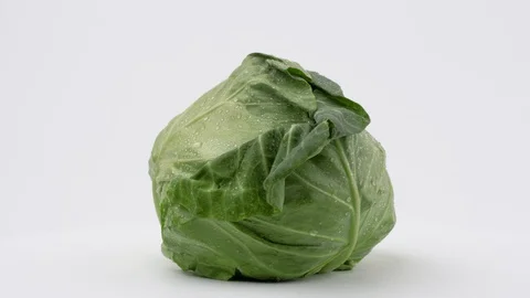 Cabbage rotates on its axis on a white background Stock Footage 129232383