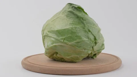 Cabbage rotates on its axis on a white background 스톡 동영상 129571267