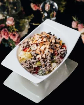 Cabbage salad with beef, fried peanuts, tomato in mayonnaise Stock Photos