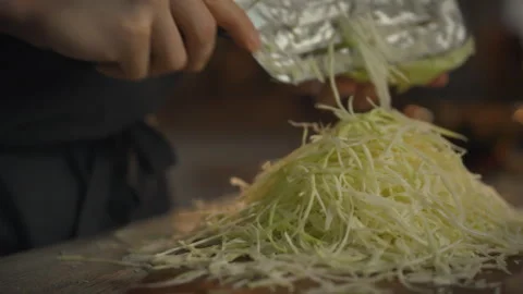 Cabbage shredding process for fermentation using a special knife Stock Footage 331348022